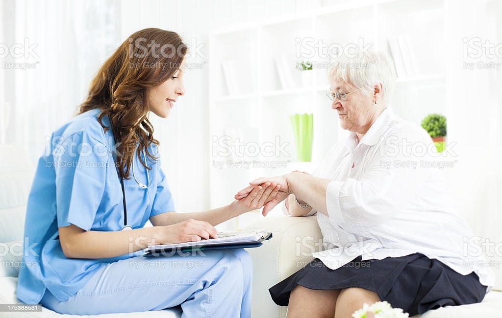 Doctor Checking Psoriasis On Senior Woman Patient Hand ...
